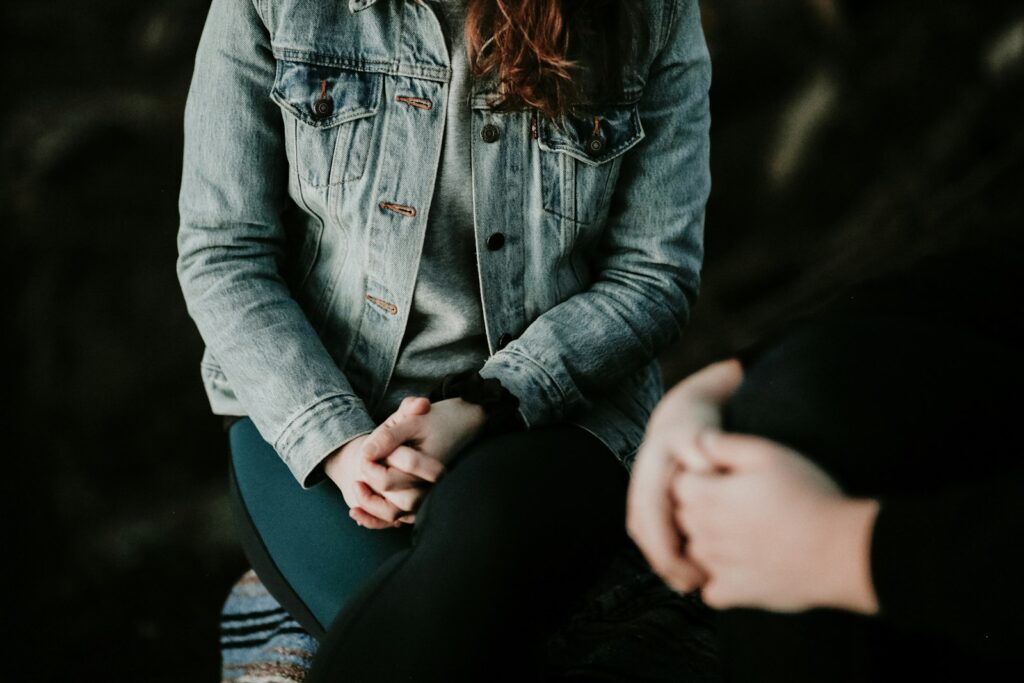 Two people in a calm therapy session, representing trauma treatment after a car accident